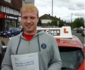 Tom with Driving test pass certificate